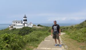 Barely able to stand due to dehydration and one bottle of beer, I pose near the lighthouse.